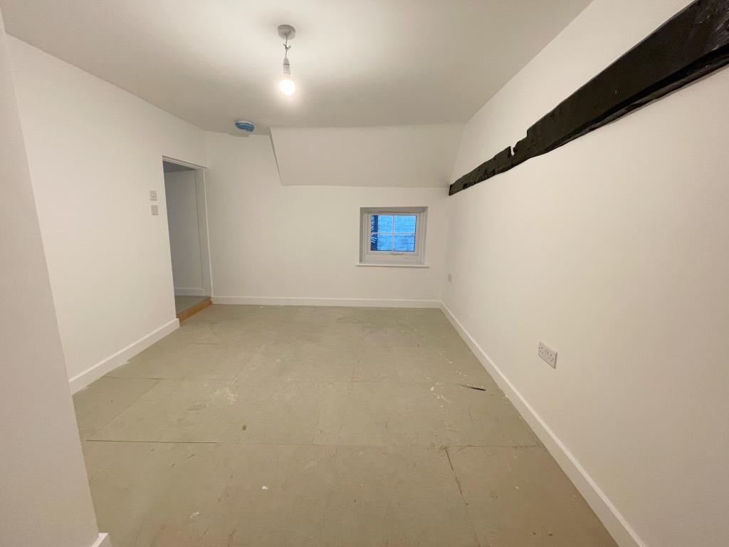 Lot: 161 - VACANT COMMERCIAL PREMISE WITH TWO FLATS ABOVE FOR COMPLETION - Bedroom in Flat B with access to en-suite shower room